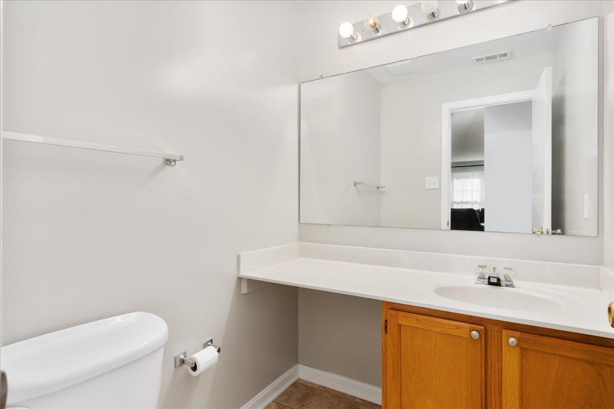 2610 Warren Way, Unit 37 Frederick, MD 21701 - Photo 19 of 42 a bathroom with a sink a toilet and mirror