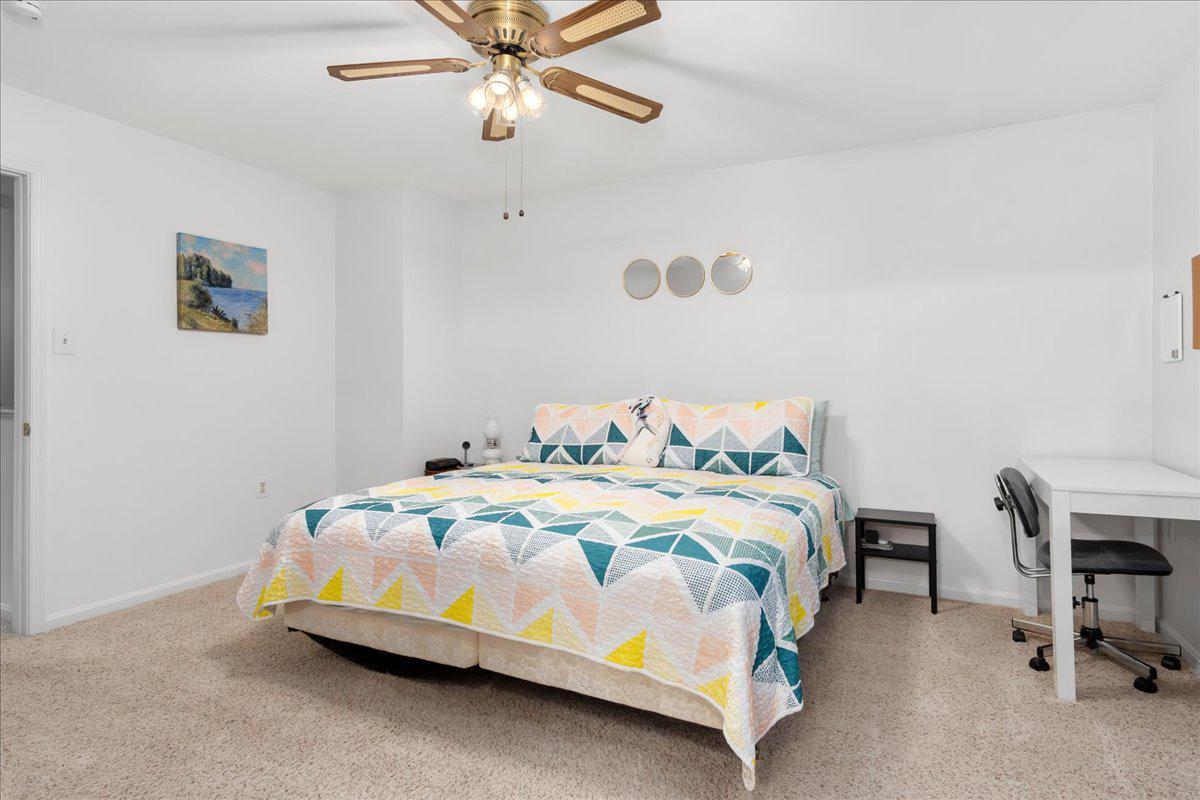 2610 Warren Way, Unit 37 Frederick, MD 21701 - Photo 23 of 42 a bedroom with a bed and a chandelier