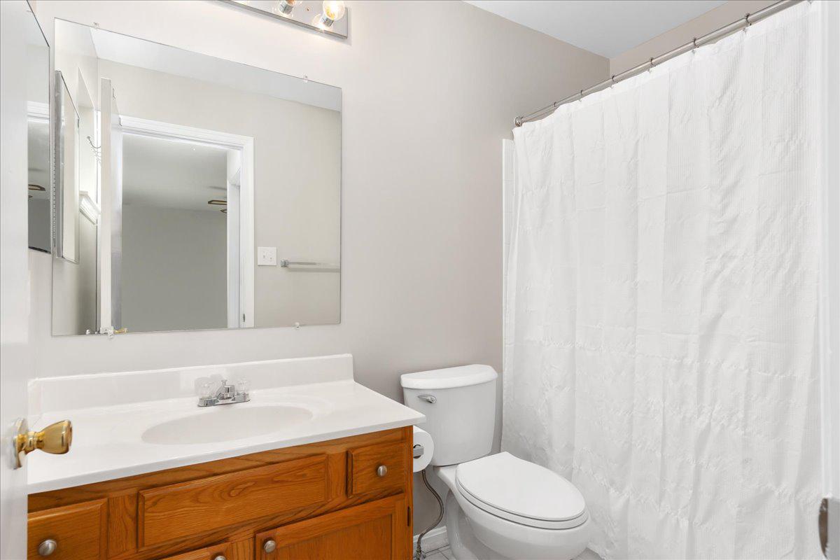 2610 Warren Way, Unit 37 Frederick, MD 21701 - Photo 24 of 42 a bathroom with a sink a toilet and a mirror