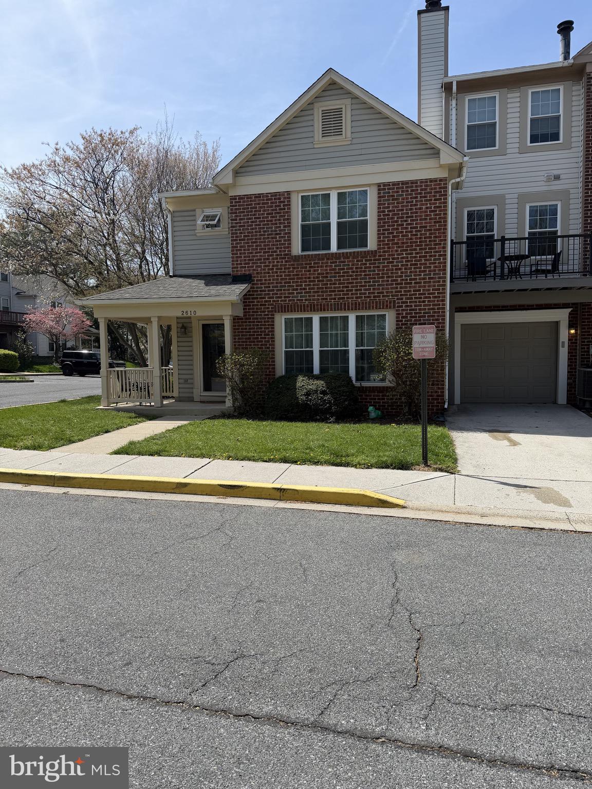 2610 Warren Way, Unit 37 Frederick, MD 21701 - Photo 41 of 42 a front view of a house with a yard