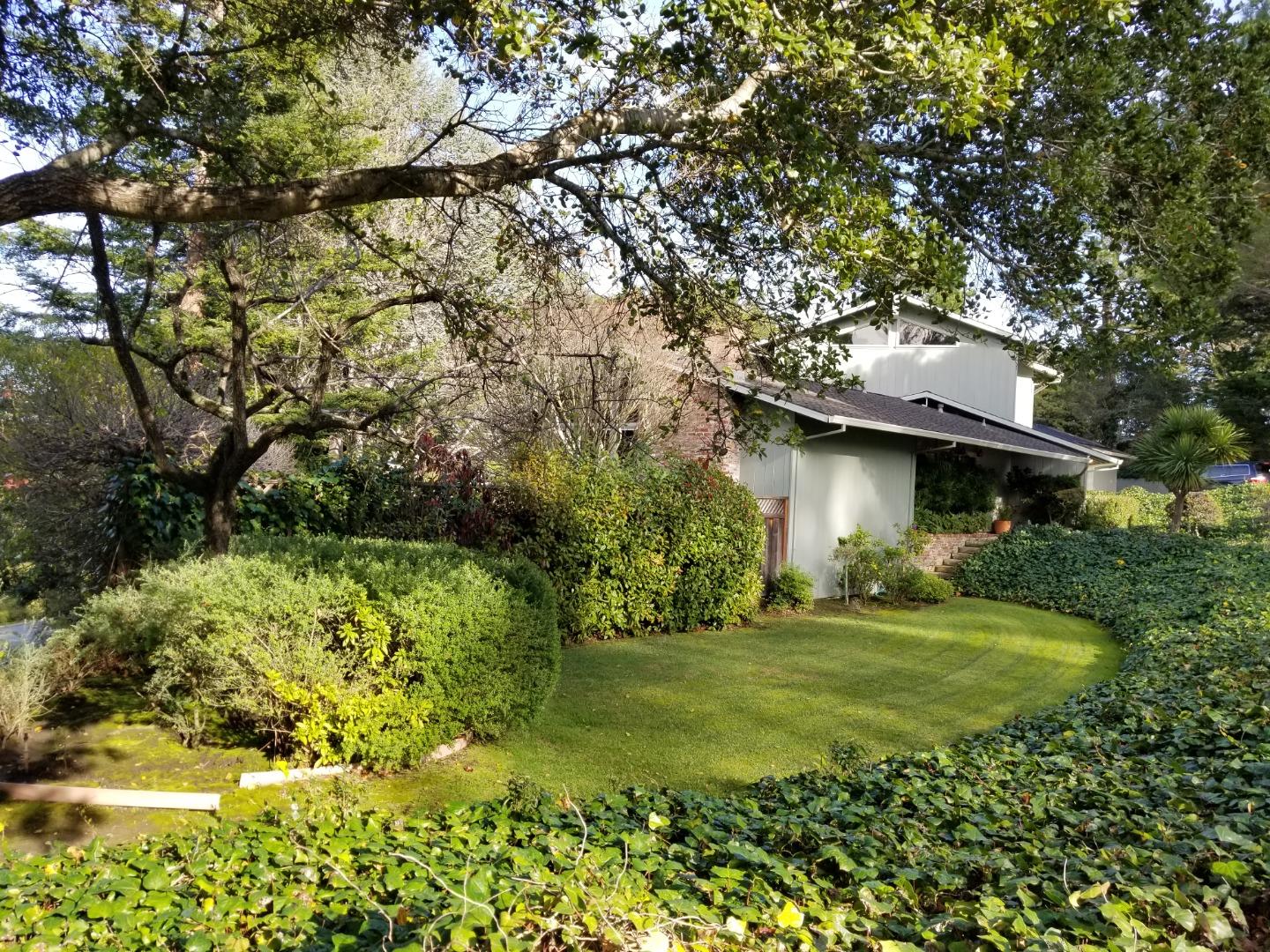 15 Roberts Way Hillsborough, CA 94010 - Photo 3 of 6 a view of a tree in front of a house with a large tree