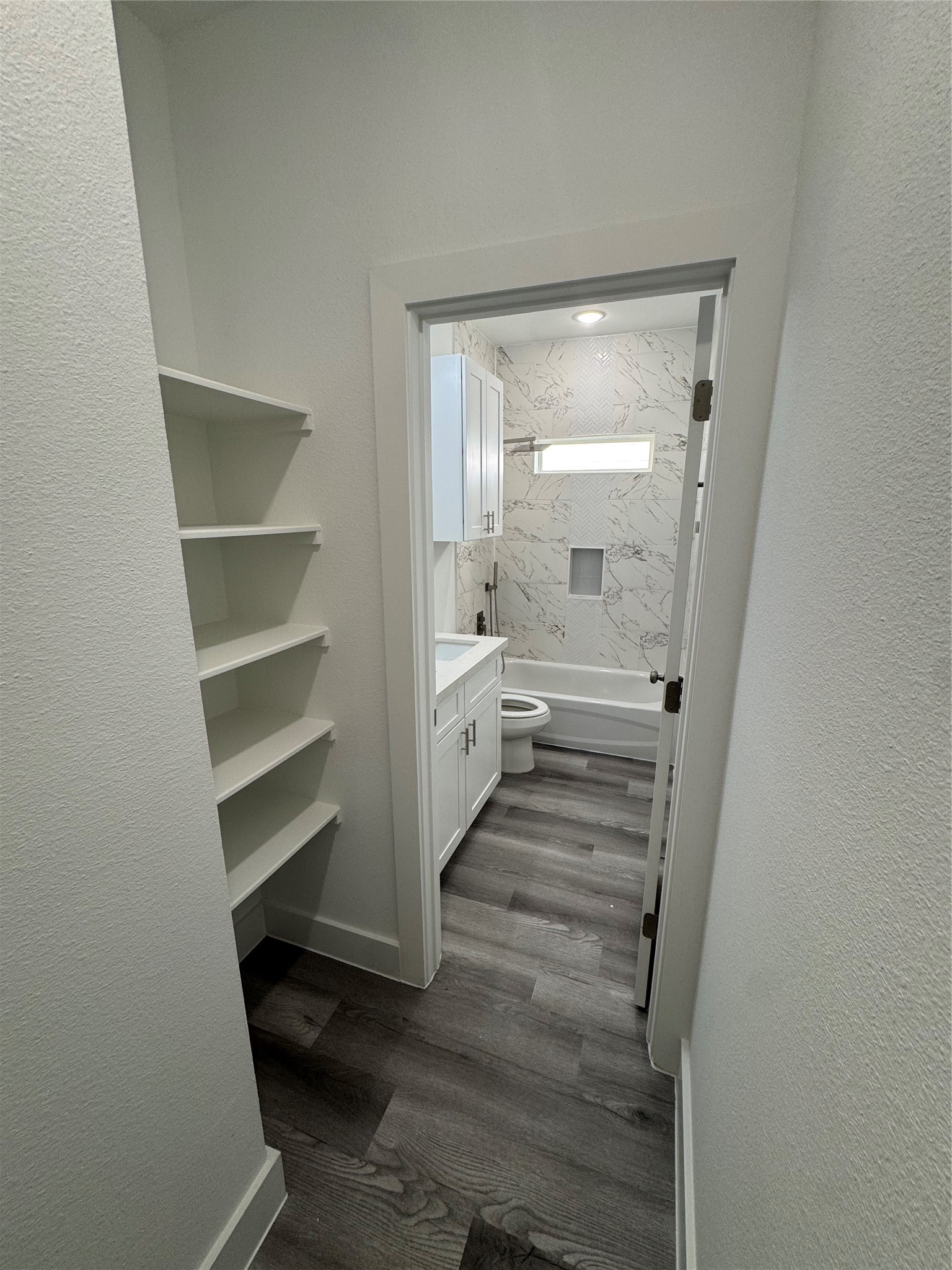 4604 Bricker Street, Unit A Houston, TX 77051 - Photo 8 of 15 a bathroom with a double vanity sink and a large mirror