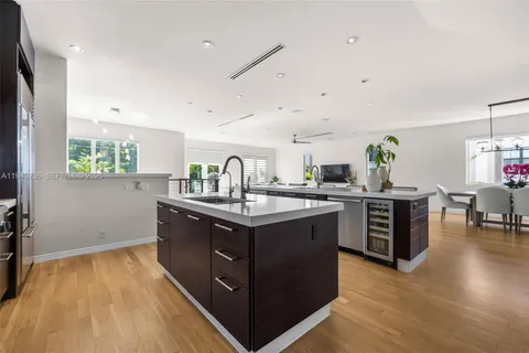 a kitchen with stainless steel appliances granite countertop a stove and a sink
