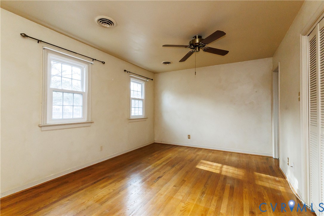 111 Arkwright Road North Chesterfield, VA 23236 - Photo 12 of 24 a view of empty room with wooden floor and fan