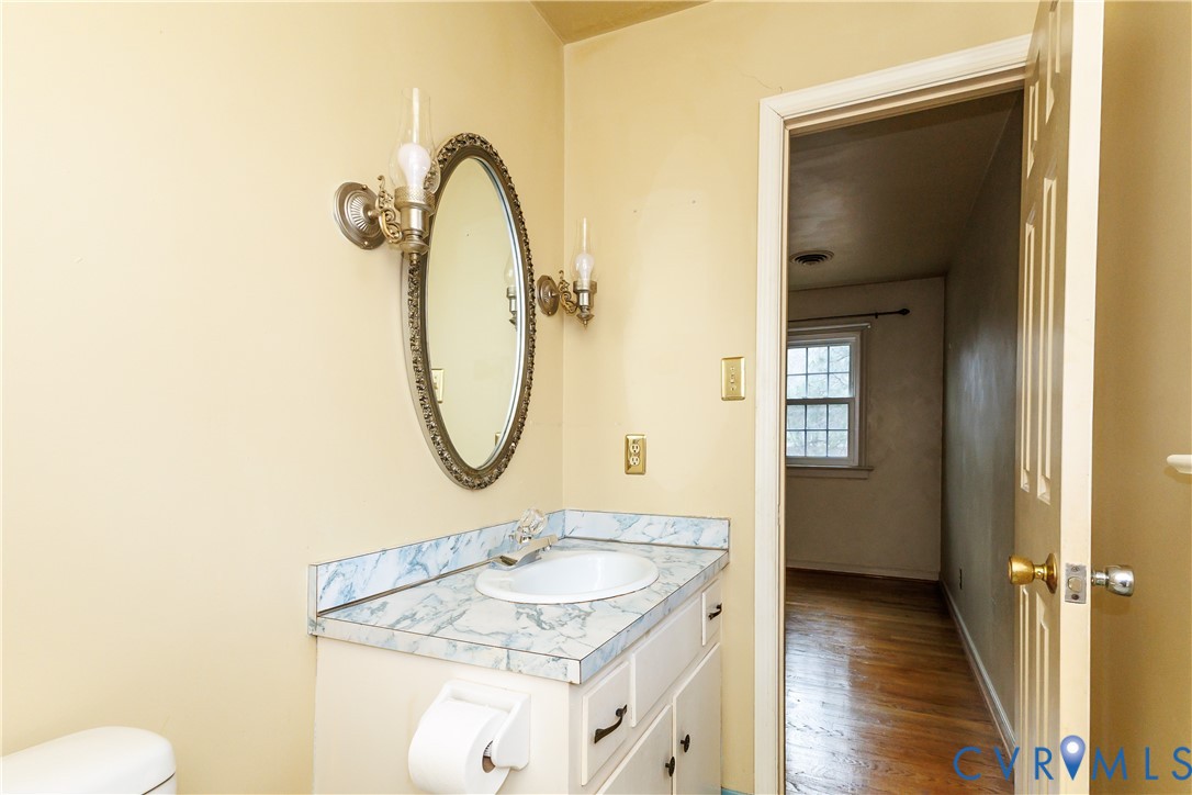 111 Arkwright Road North Chesterfield, VA 23236 - Photo 15 of 24 a bathroom with a granite countertop sink and a mirror