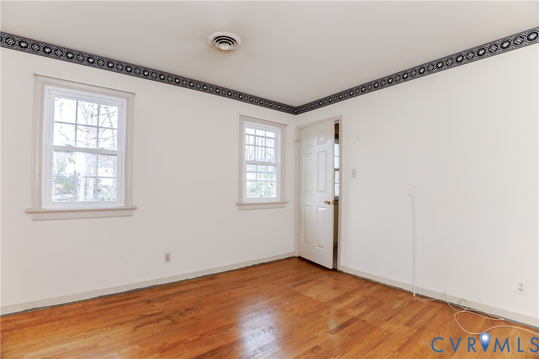111 Arkwright Road North Chesterfield, VA 23236 - Photo 20 of 24 a view of an empty room with wooden floor and a window