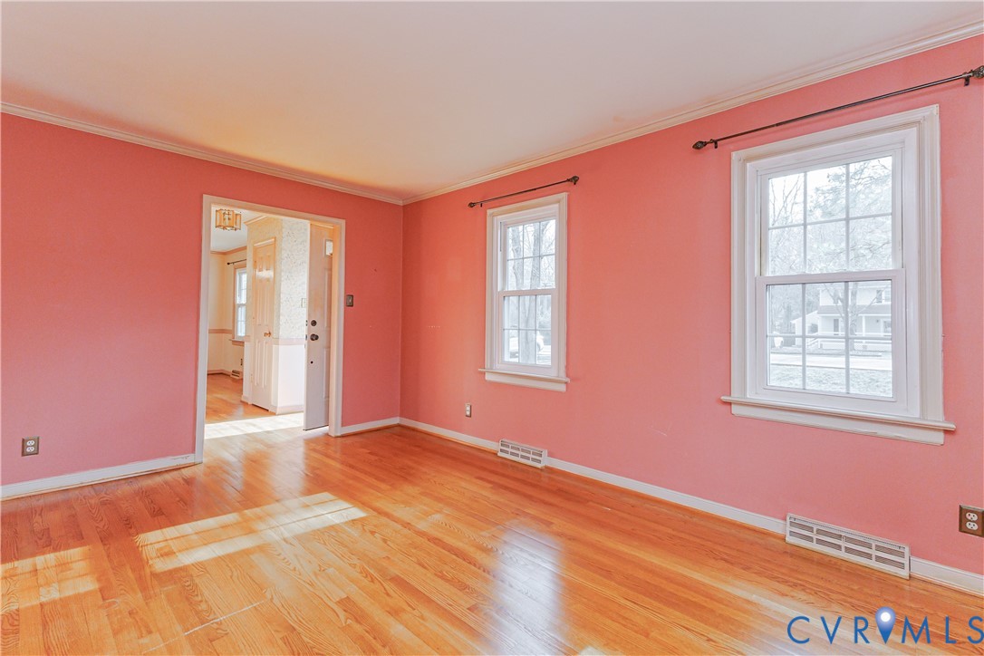 111 Arkwright Road North Chesterfield, VA 23236 - Photo 4 of 24 a view of an empty room with wooden floor and a window