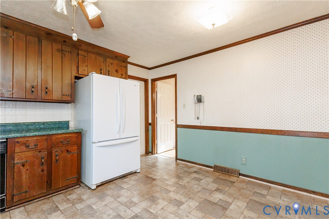 111 Arkwright Road North Chesterfield, VA 23236 - Photo 9 of 24 a kitchen with refrigerator and cabinets