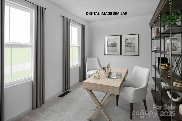 a view of a dining room with furniture and a window