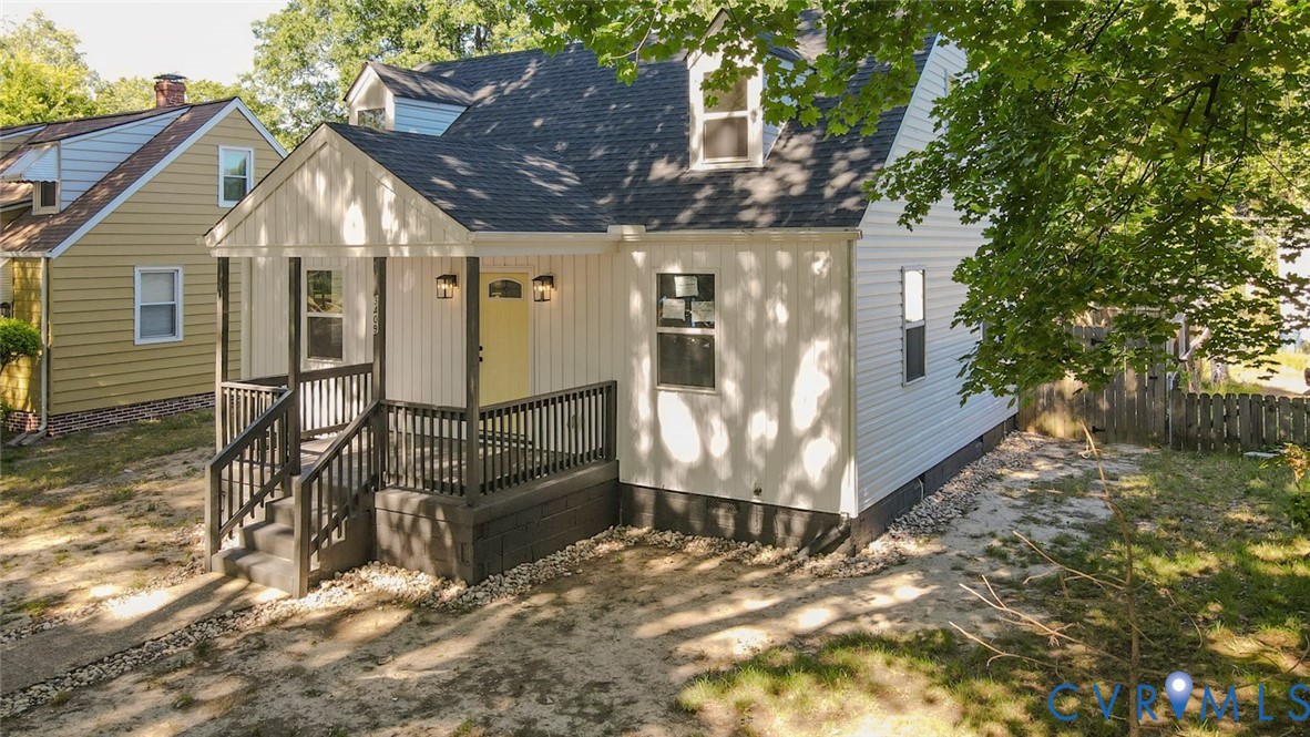3409 Meadowbridge Road Richmond, VA 23222 - Photo 2 of 32 a view of a house with wooden fence and large windows