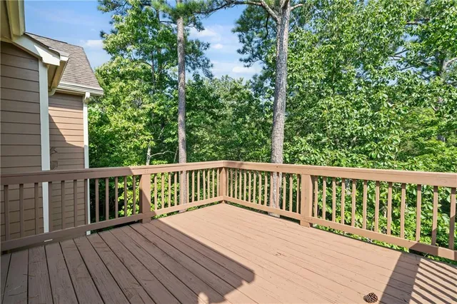 a kitchen with wooden floors and wooden cabinets