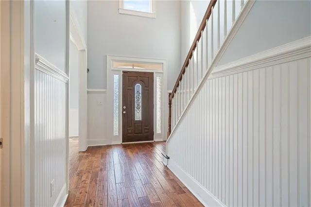 a view of a dining room with furniture wooden floor and chandelier