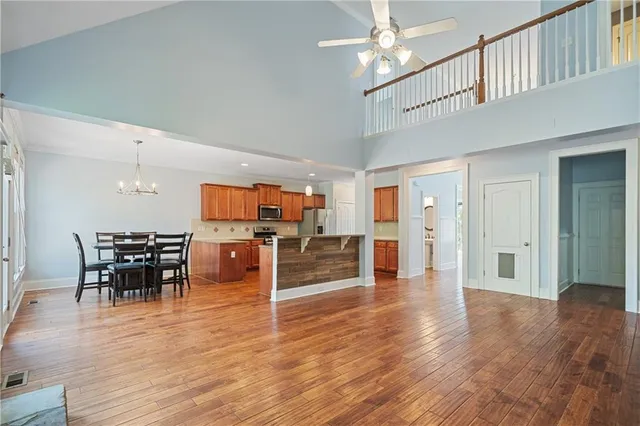 a spacious bathroom with a double vanity sink a mirror and a shower