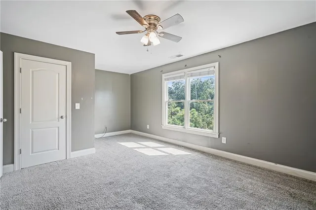 a balcony with wooden floor and fence