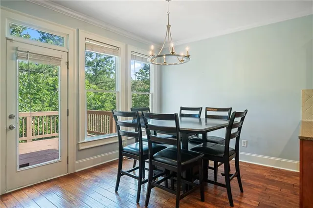 a kitchen with stainless steel appliances granite countertop wooden cabinets a stove top oven a sink and dishwasher