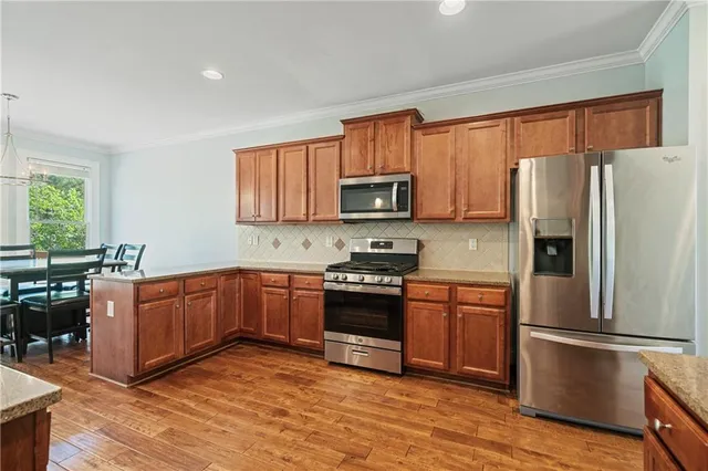 a view of balcony with wooden floor and fence