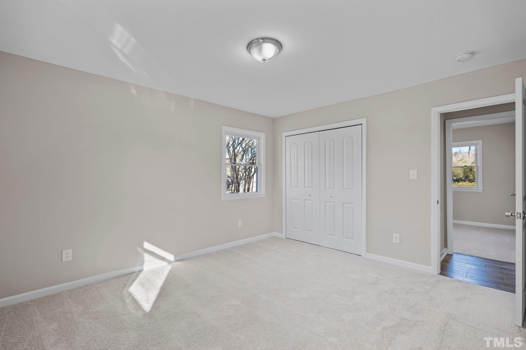 101 Holly Road Castle Hayne, NC 28429 - Photo 13 of 31 an empty room with a empty space and windows