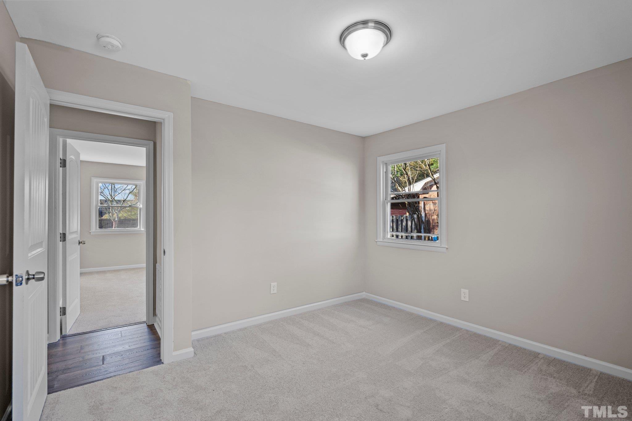 101 Holly Road Castle Hayne, NC 28429 - Photo 17 of 31 an empty room with windows