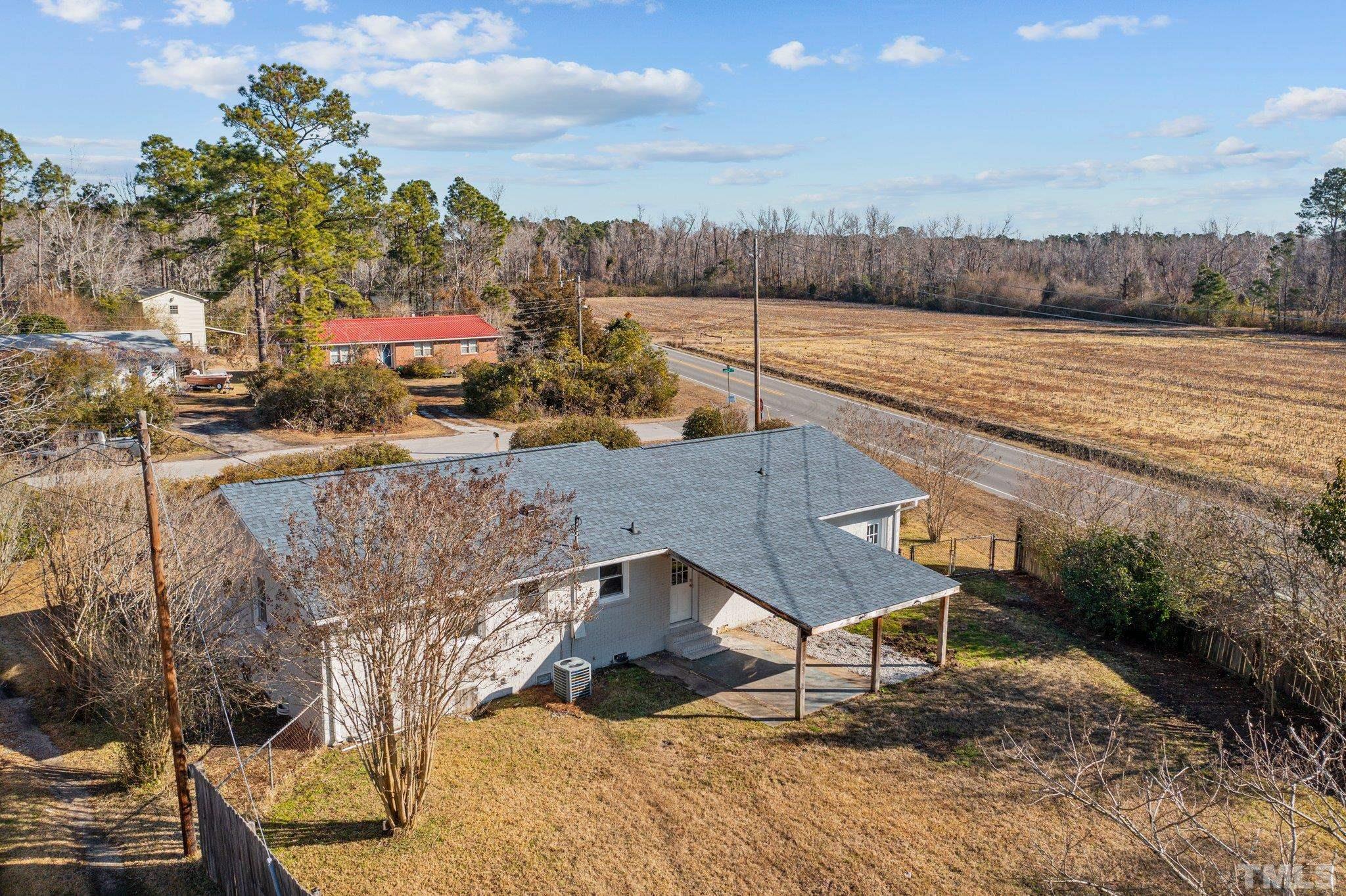 101 Holly Road Castle Hayne, NC 28429 - Photo 27 of 31 a view of a terrace with wooden floor and lake view