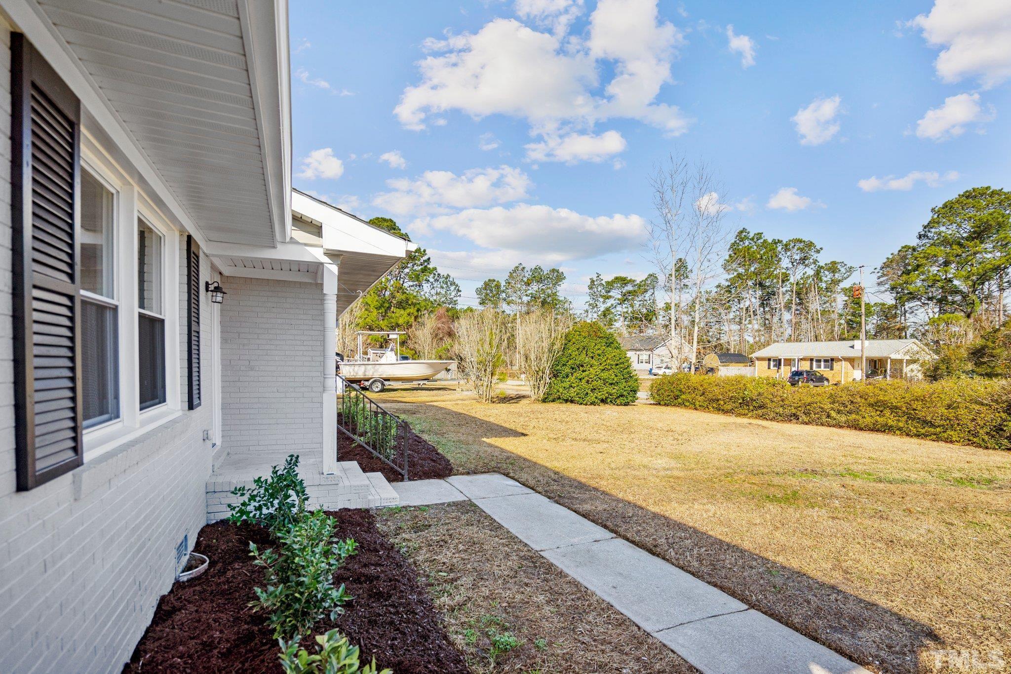 101 Holly Road Castle Hayne, NC 28429 - Photo 29 of 31 a view of residential houses with outdoor space and street view