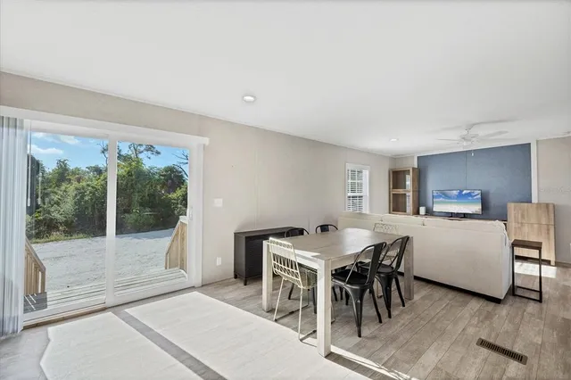 a view of a dining room with furniture window and outside view