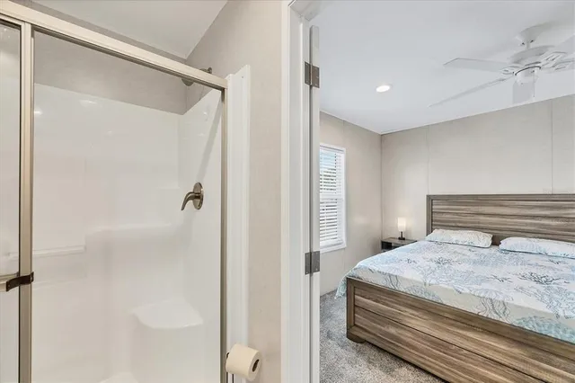 a bedroom with a bed and a mirror