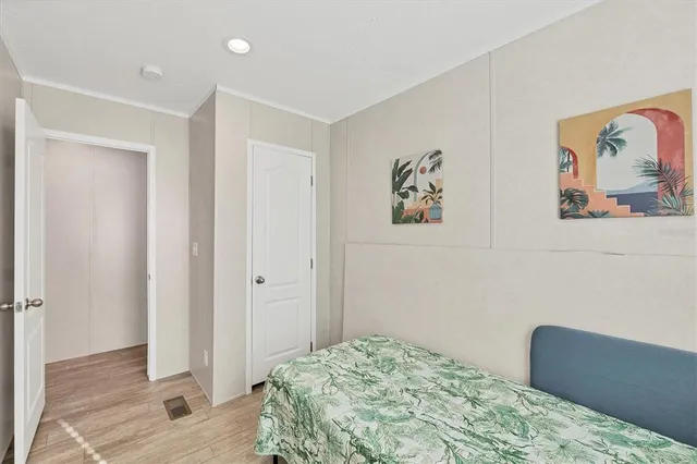 a bedroom with a bed and a couch