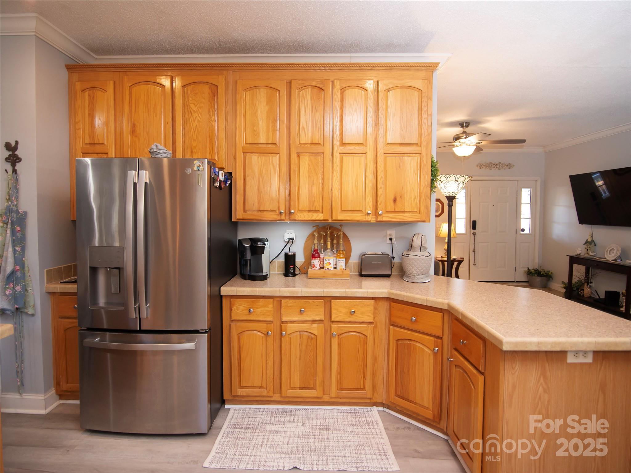 3053 Dalton Drive Morganton, NC 28655 - Photo 11 of 47 a kitchen with a refrigerator a sink and cabinets