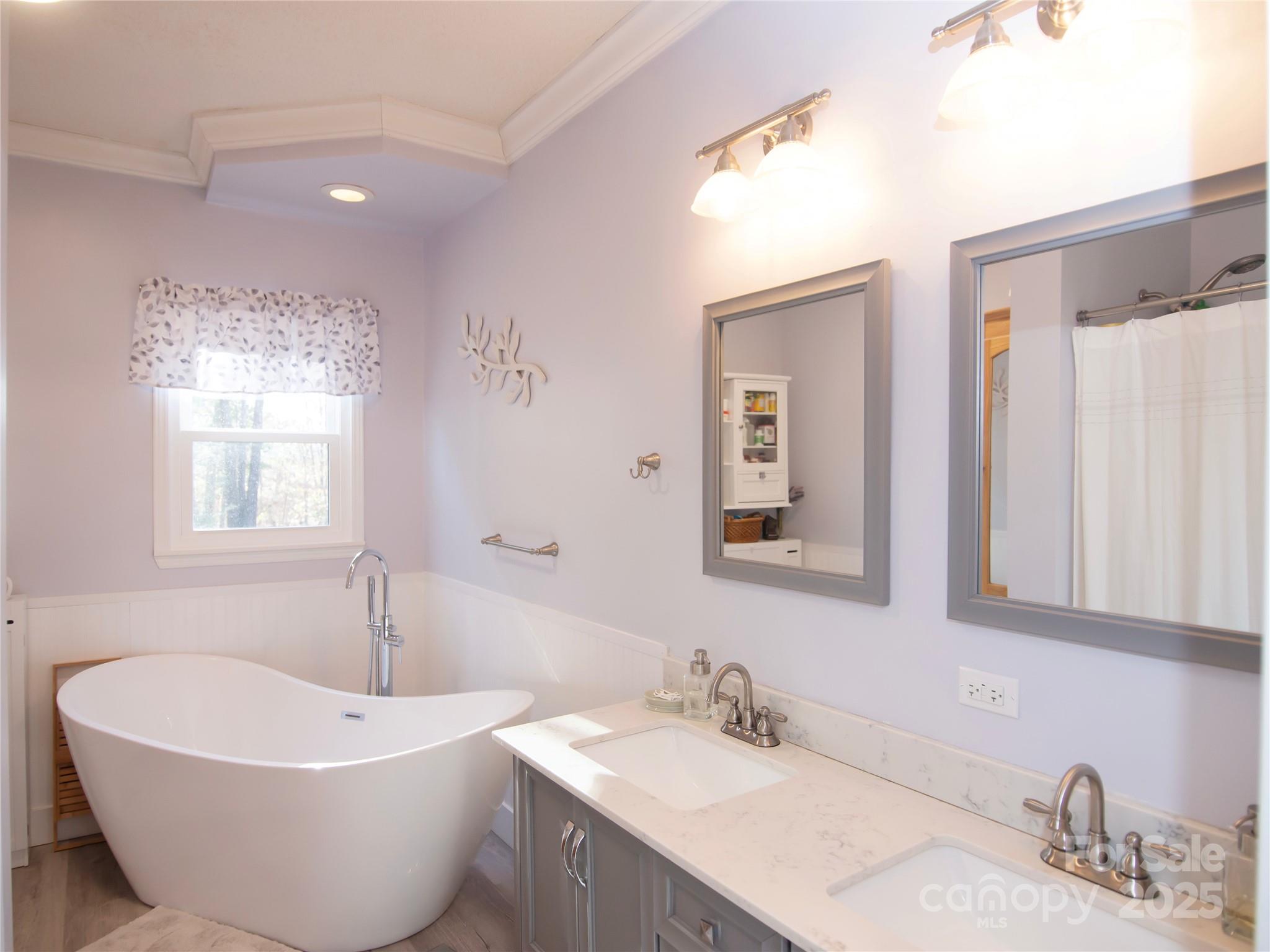 3053 Dalton Drive Morganton, NC 28655 - Photo 21 of 47 a bathroom with a white tub sink and mirror
