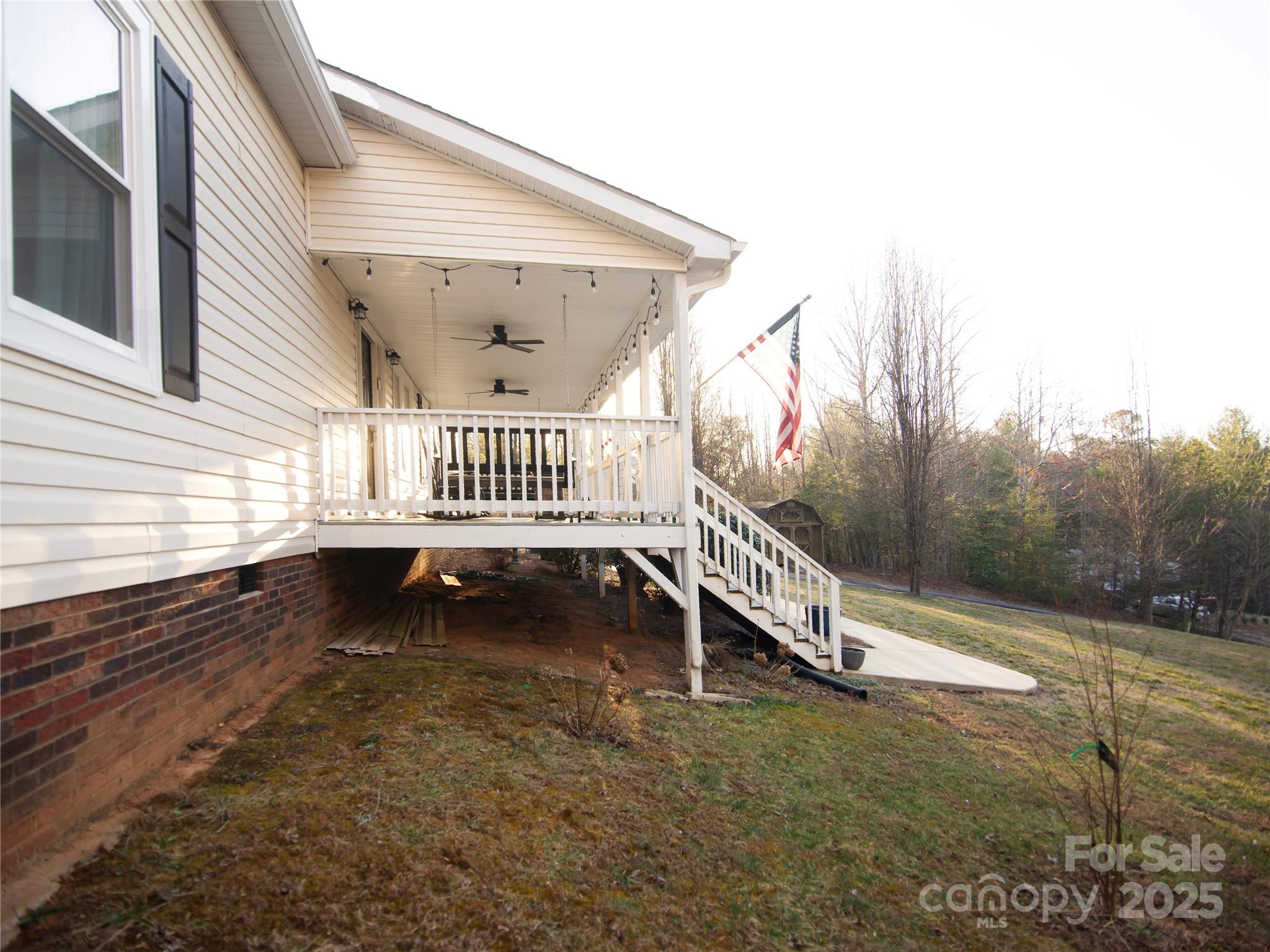 3053 Dalton Drive Morganton, NC 28655 - Photo 34 of 47 a view of an outdoor space with deck and a garden