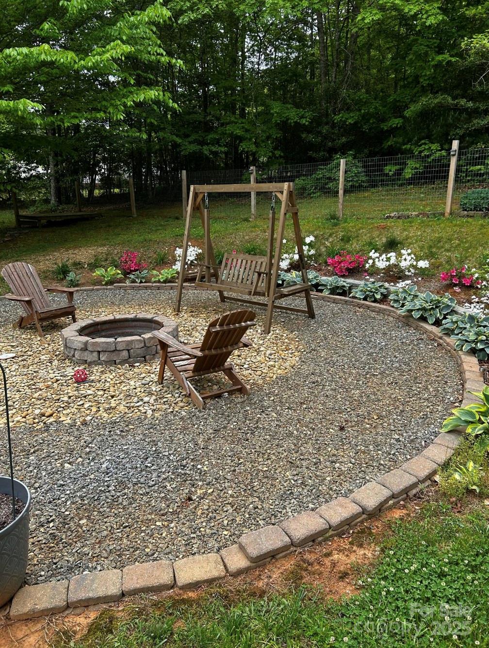 3053 Dalton Drive Morganton, NC 28655 - Photo 47 of 47 a view of a wooden deck with chairs and potted plants