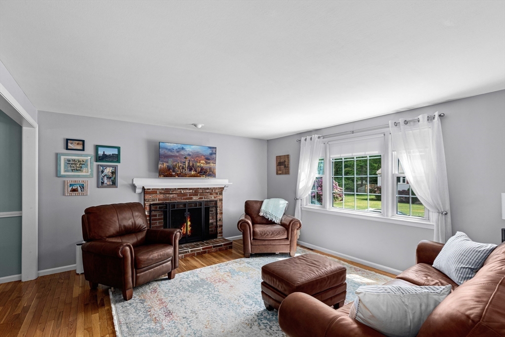29 Worrall Road Plymouth, MA 02360 - Photo 15 of 38 a living room with furniture a fireplace and a window