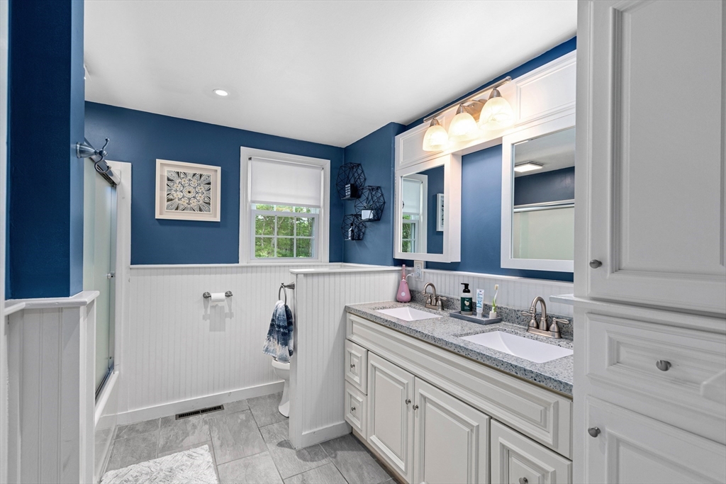 29 Worrall Road Plymouth, MA 02360 - Photo 23 of 38 a bathroom with a sink a mirror and a bathtub