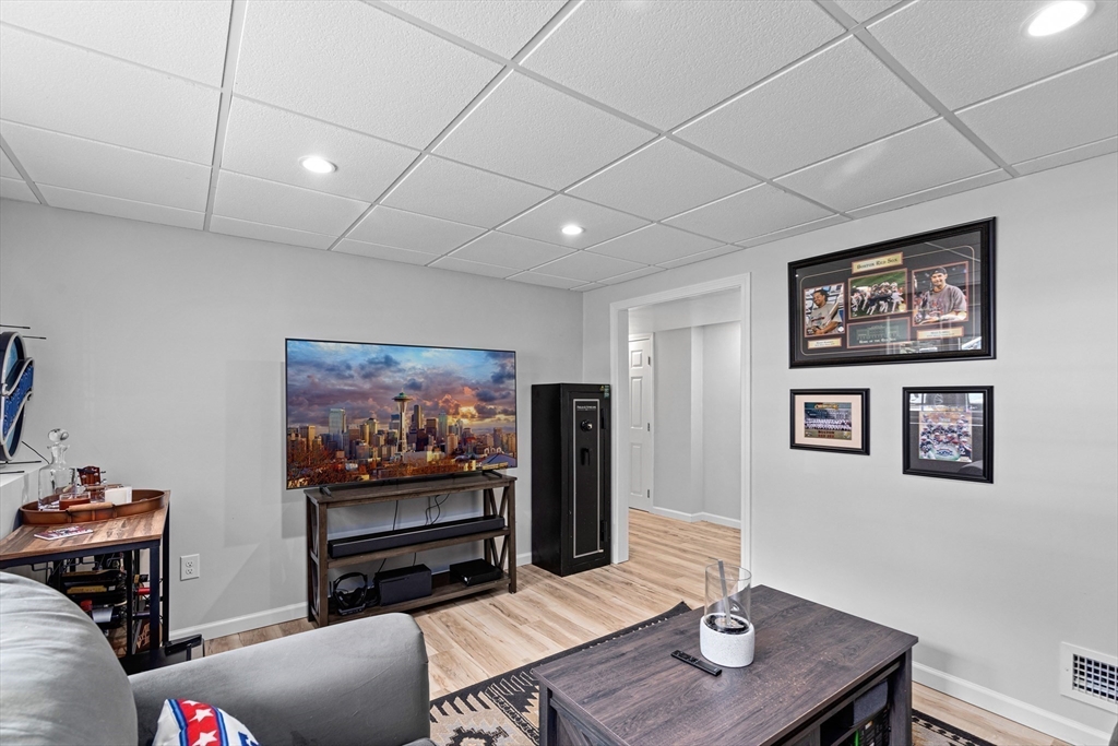 29 Worrall Road Plymouth, MA 02360 - Photo 32 of 38 a living room with furniture and a flat screen tv