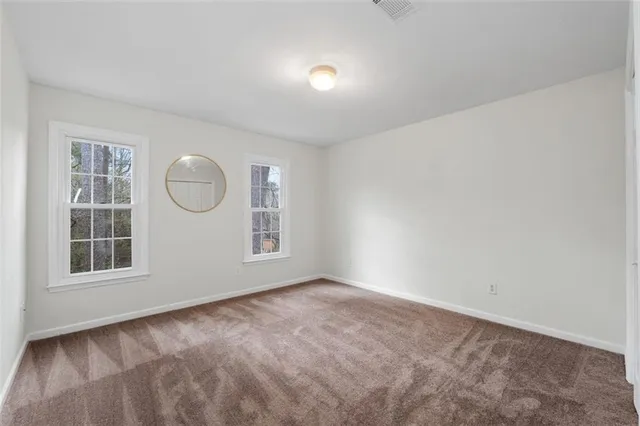 a bathroom with 2 sink and a mirror