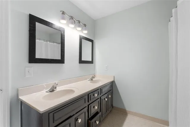 a bed room with a bed and a mirror