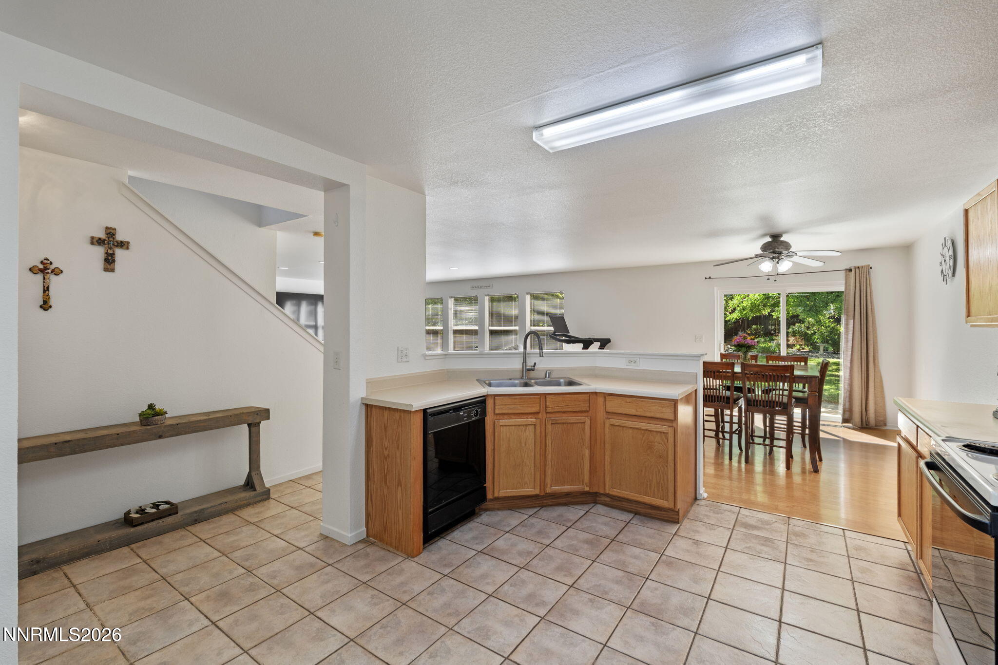 9490 Autumn Leaf Way Reno, NV 89506 - Photo 10 of 31 kitchen looking at sink hall back yard
