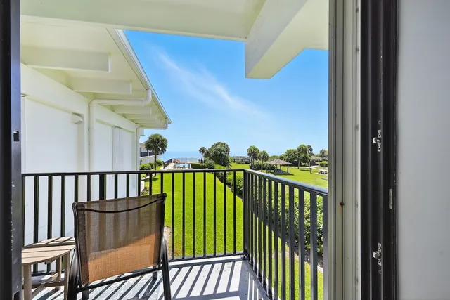a view of balcony with furniture