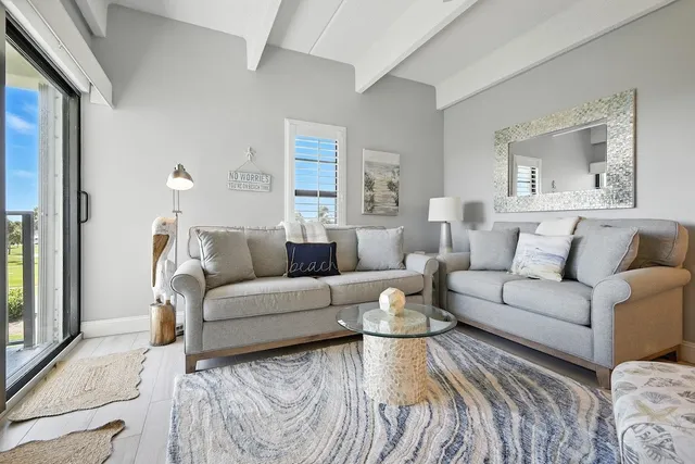 a living room with furniture and a window