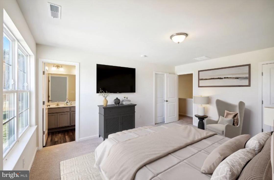 14 Patterson Lane Newark, DE 19702 - Photo 6 of 7 a bedroom with a bed and a flat screen tv