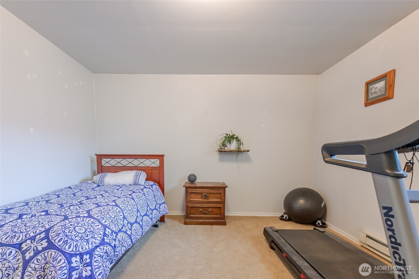 110 Strande Road Ellensburg, WA 98926 - Photo 23 of 39 a bedroom with a bed and a chandelier