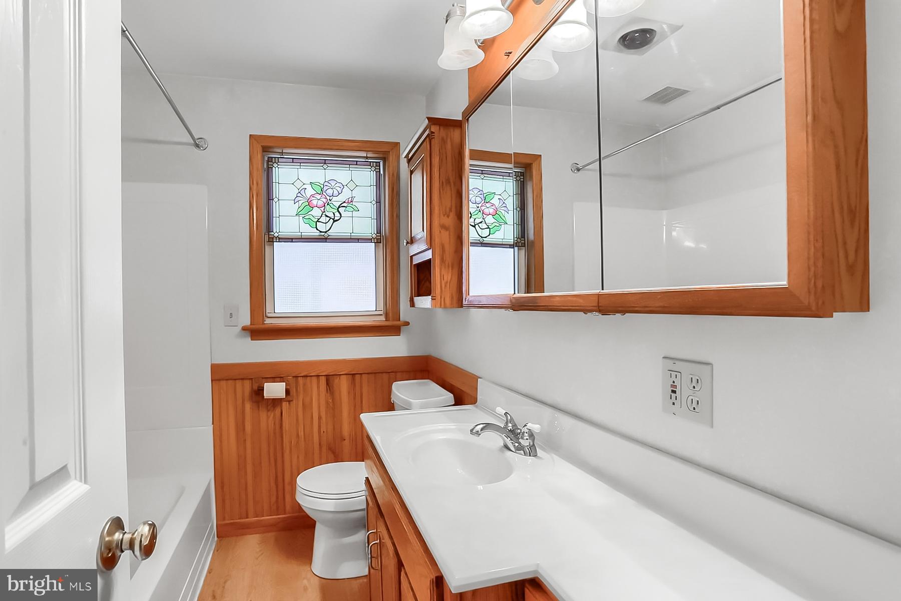 2011 Columbia Avenue Camp Hill, PA 17011 - Photo 16 of 33 a bathroom with a sink toilet and mirror