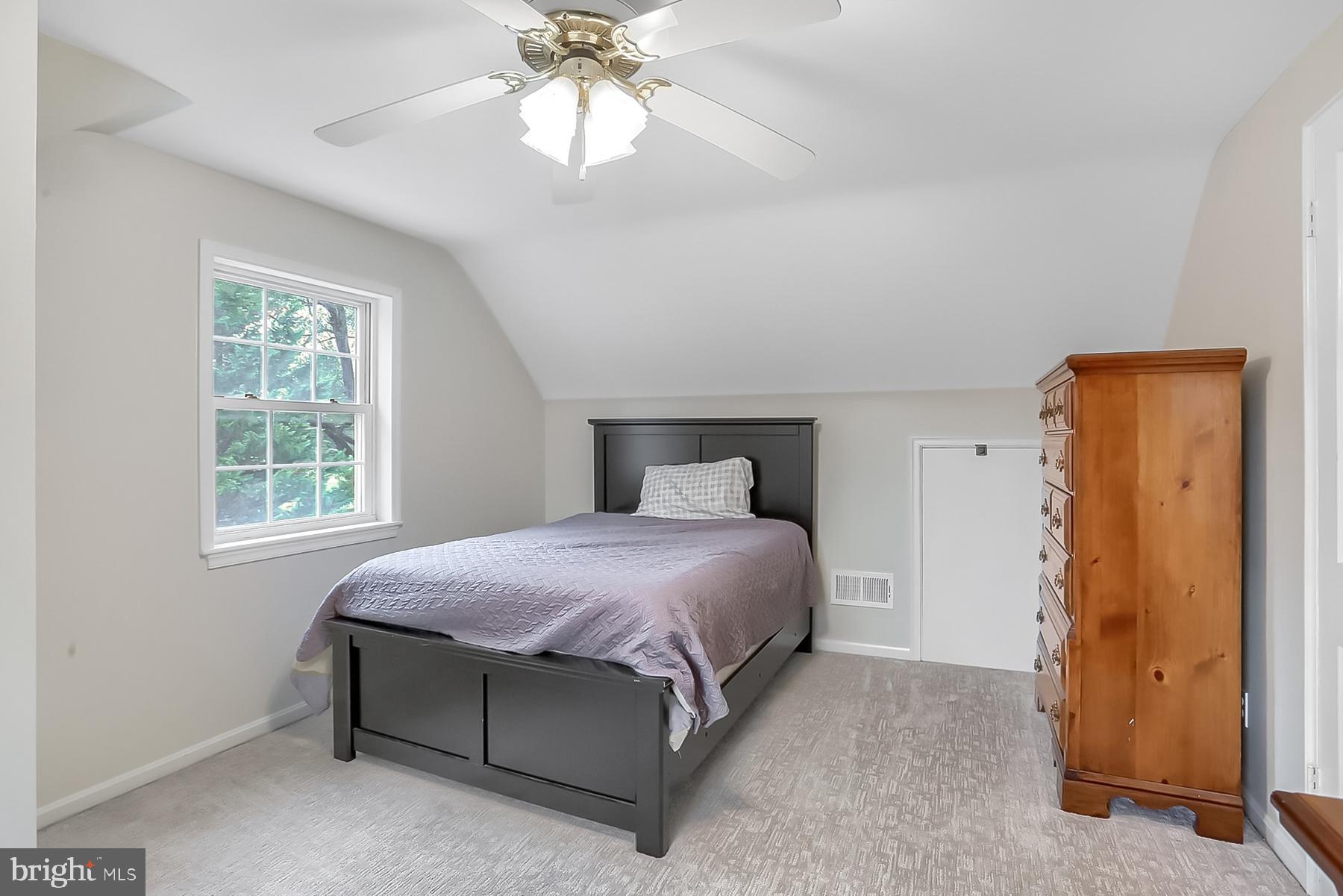 2011 Columbia Avenue Camp Hill, PA 17011 - Photo 21 of 33 a bedroom with a bed and a chandelier