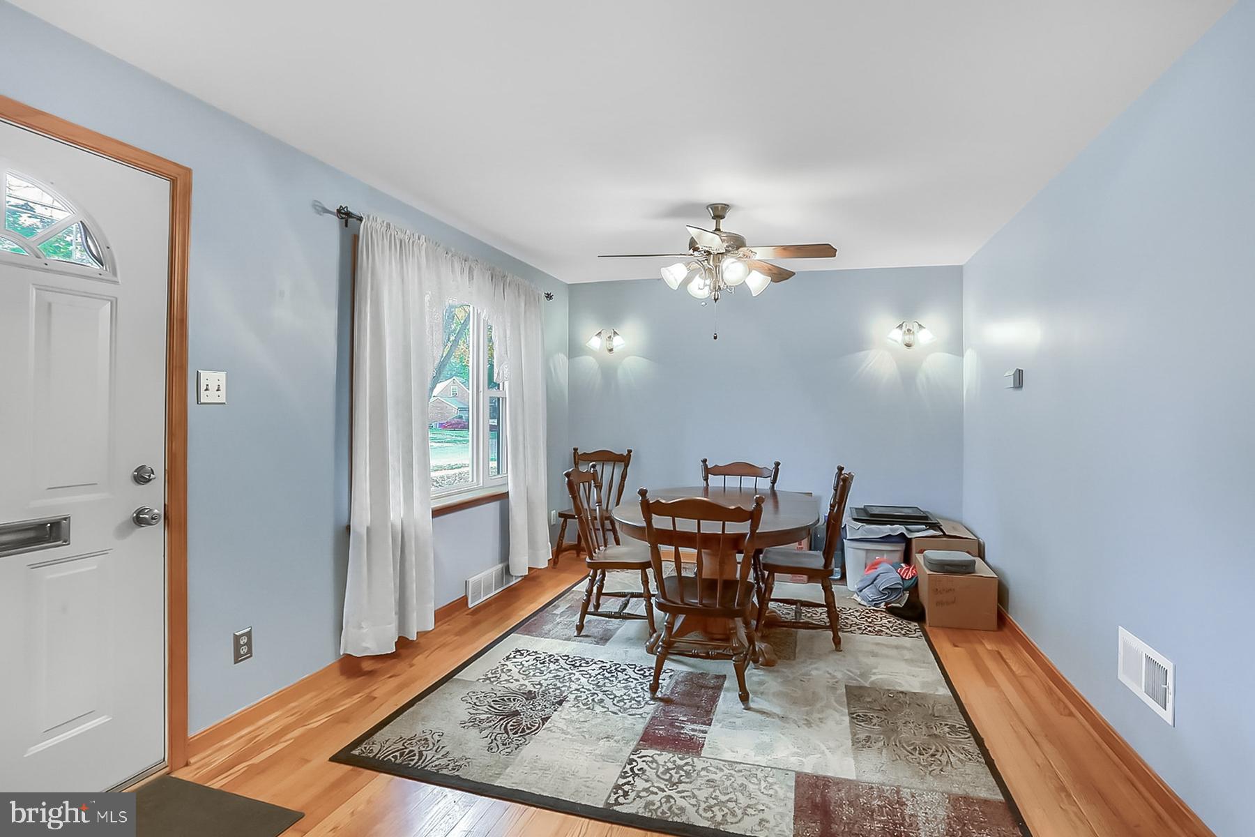 2011 Columbia Avenue Camp Hill, PA 17011 - Photo 5 of 33 a view of a dining room with furniture and wooden floor