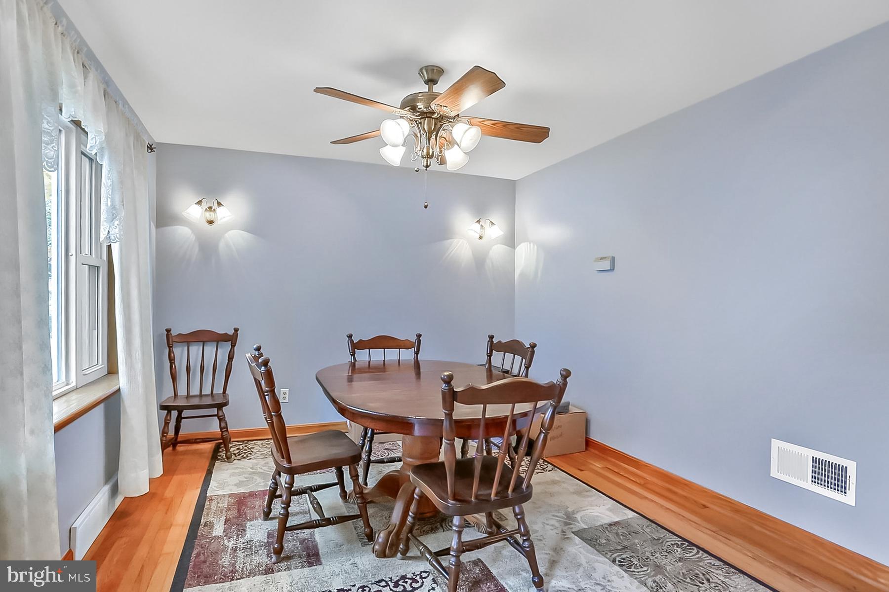 2011 Columbia Avenue Camp Hill, PA 17011 - Photo 6 of 33 a view of a dining room with furniture and chandelier