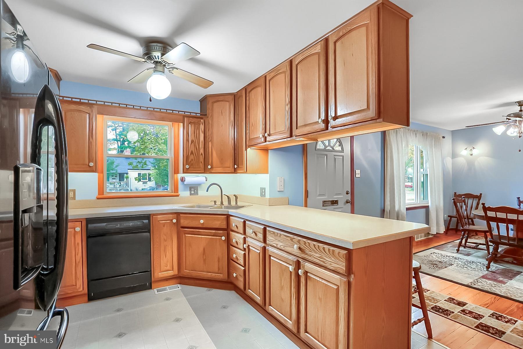2011 Columbia Avenue Camp Hill, PA 17011 - Photo 10 of 33 a kitchen that has a sink stainless steel appliances a window and cabinets