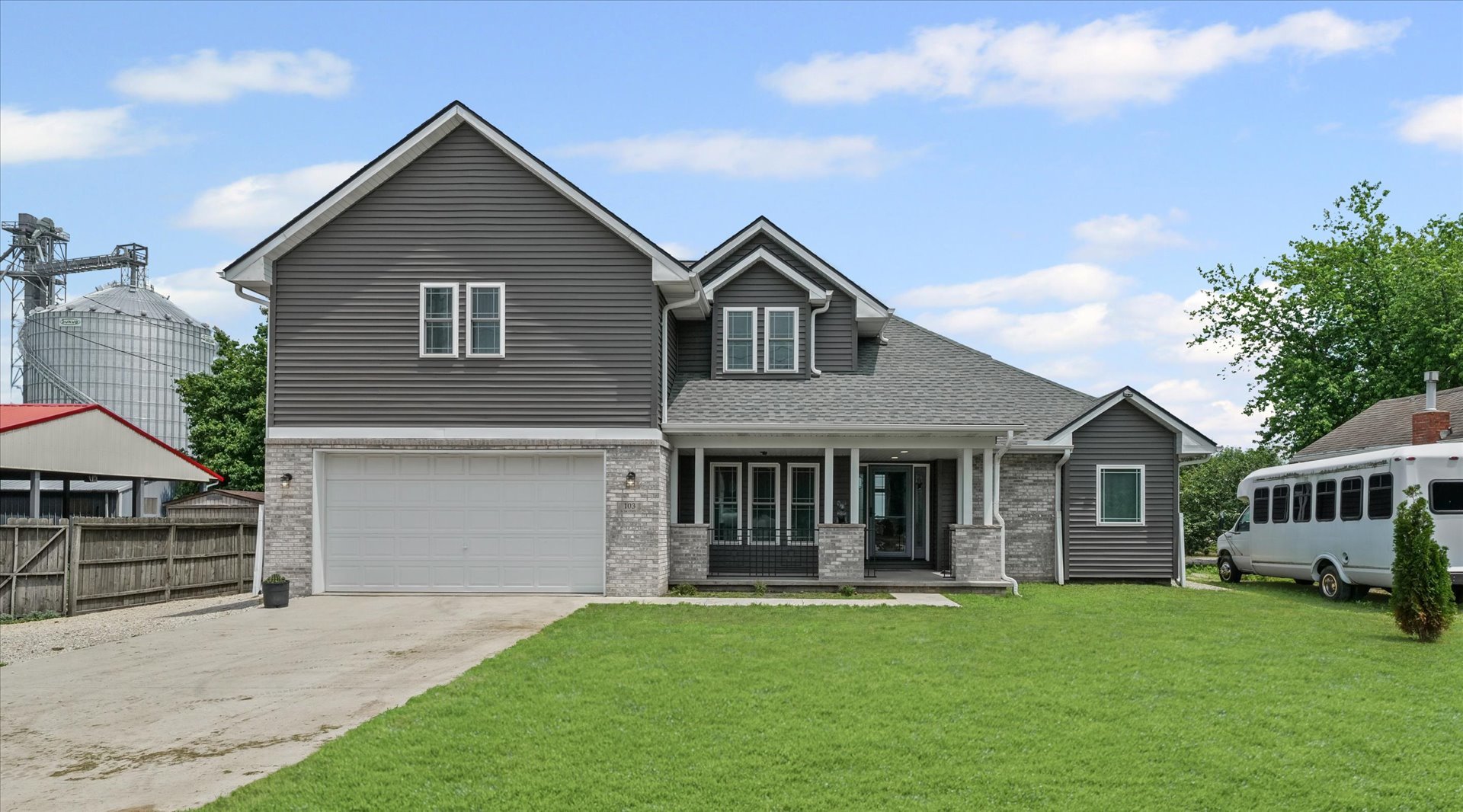 a front view of a house with a garden