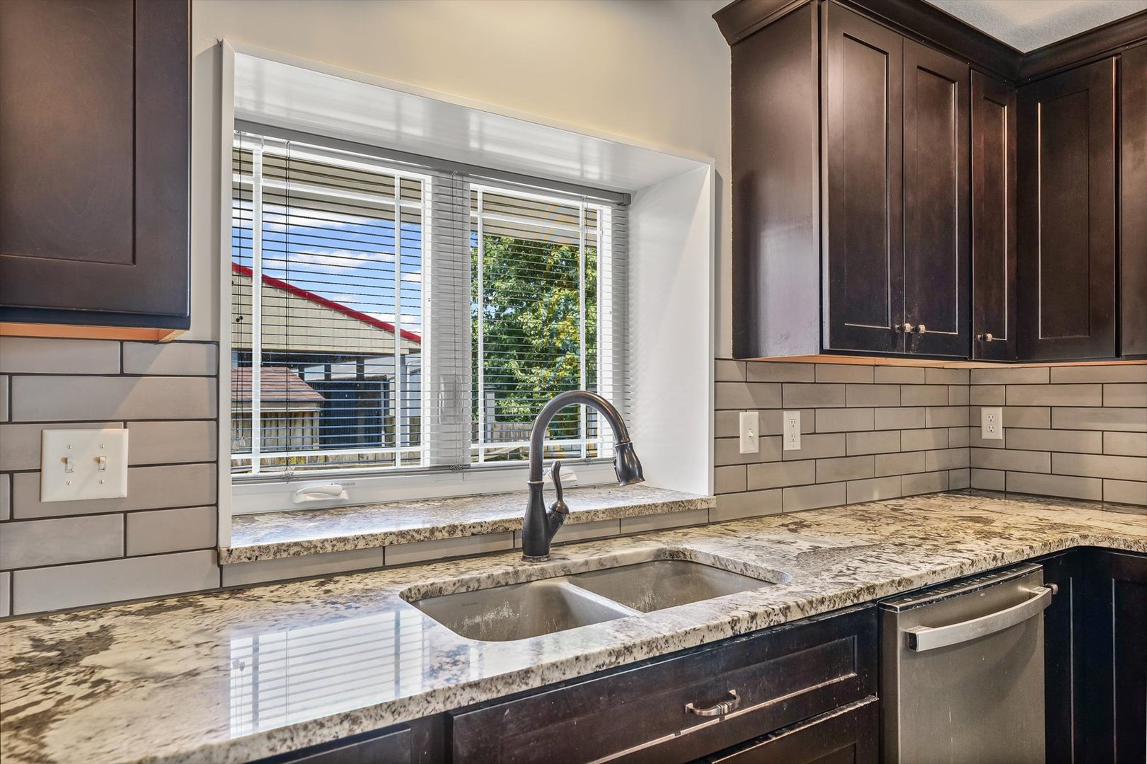 103 1st Street Strawn, IL 61775 - Photo 11 of 50 a kitchen with granite countertop a sink and a window