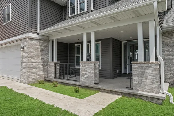 front view of a house with a yard