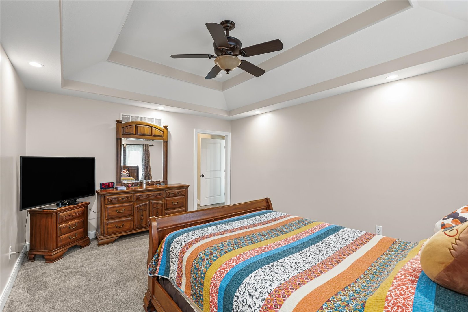 103 1st Street Strawn, IL 61775 - Photo 23 of 50 a bedroom with a bed and a flat screen tv